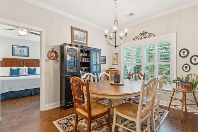 dining area with ornamental molding, a wealth of natural light, and dark wood-type flooring