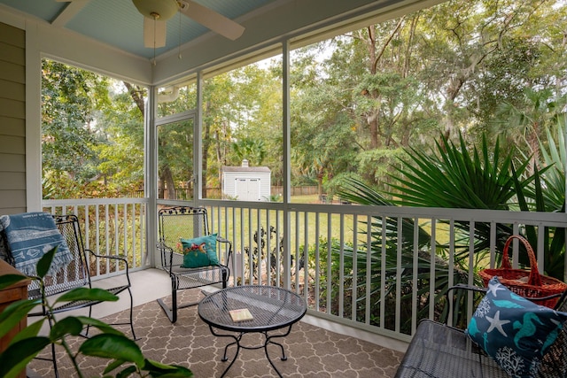 sunroom / solarium with ceiling fan