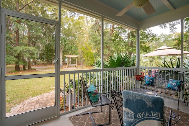 sunroom / solarium with ceiling fan