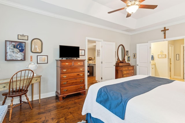 bedroom featuring dark hardwood / wood-style floors, ceiling fan, crown molding, and ensuite bath