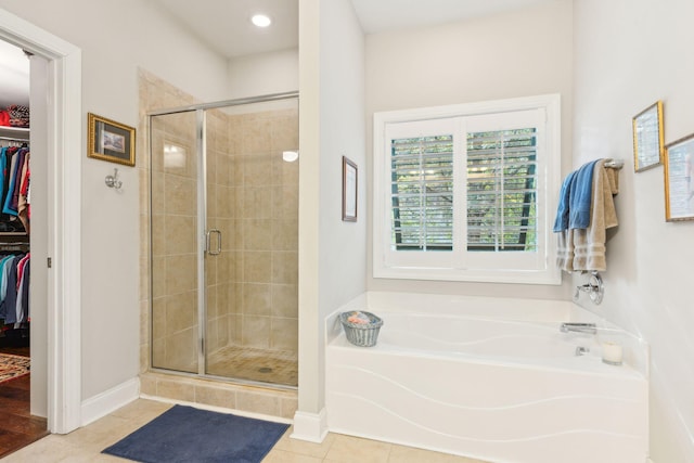 bathroom with tile patterned flooring and plus walk in shower