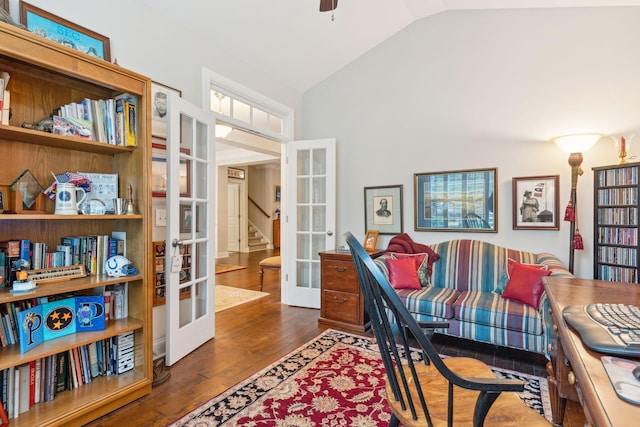 home office with lofted ceiling, french doors, ceiling fan, and dark hardwood / wood-style floors