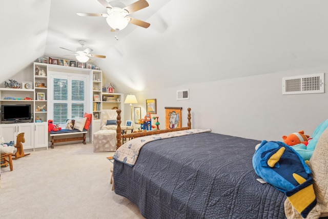 carpeted bedroom with ceiling fan and vaulted ceiling