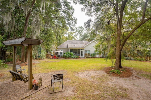 view of yard with a sunroom