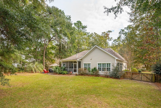 rear view of house with a lawn