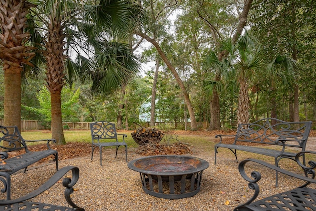 view of yard with an outdoor fire pit