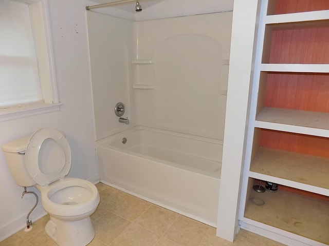 bathroom with toilet, tile patterned flooring, and  shower combination