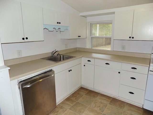 kitchen with dishwasher, sink, ornamental molding, and white cabinets