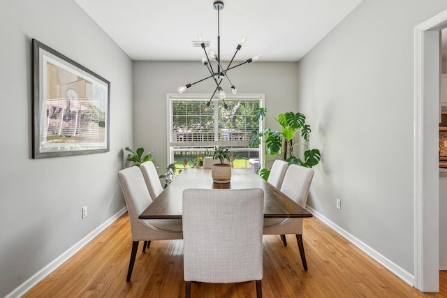 334 Mossy Oak Way, Mount Pleasant, SC 29464 - dining room featuring a chandelier, light wood-type flooring, and baseboards