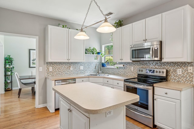 334 Mossy Oak Way, Mount Pleasant, SC 29464 - kitchen featuring appliances with stainless steel finishes, a sink, light countertops, and white cabinetry