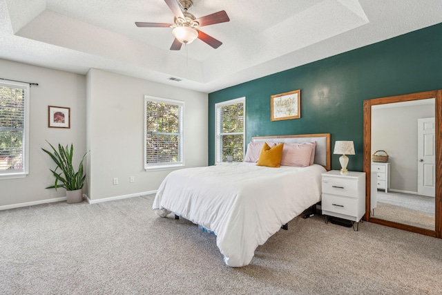 334 Mossy Oak Way, Mount Pleasant, SC 29464 - bedroom featuring a raised ceiling, carpet flooring, baseboards, a ceiling fan, and a textured ceiling