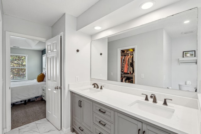 334 Mossy Oak Way, Mount Pleasant, SC 29464 - ensuite bathroom featuring double vanity, marble finish flooring, toilet, recessed lighting, and a spacious closet