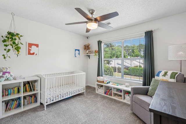 334 Mossy Oak Way, Mount Pleasant, SC 29464 - bedroom featuring a crib, a textured ceiling, carpet floors, and a ceiling fan