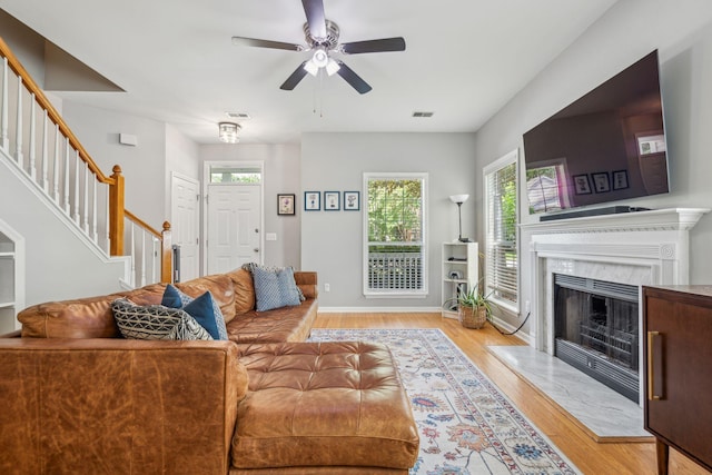 334 Mossy Oak Way, Mount Pleasant, SC 29464 - living room featuring stairs, ceiling fan, wood finished floors, and a fireplace