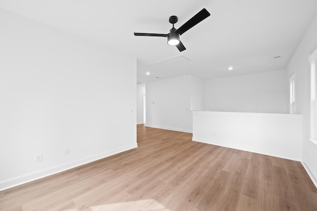 spare room featuring ceiling fan and light hardwood / wood-style floors