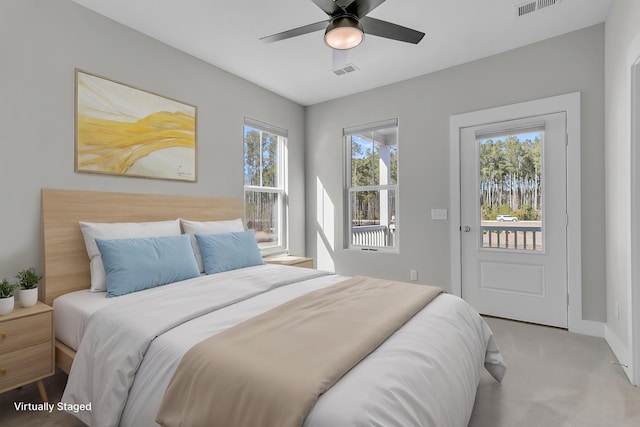 bedroom with carpet floors, access to exterior, visible vents, ceiling fan, and baseboards