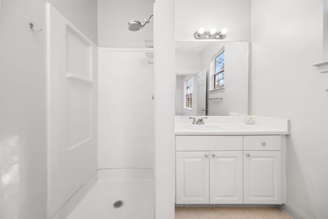 bathroom with vanity and walk in shower