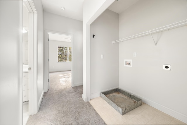 laundry room with electric dryer hookup, hookup for a washing machine, and light colored carpet