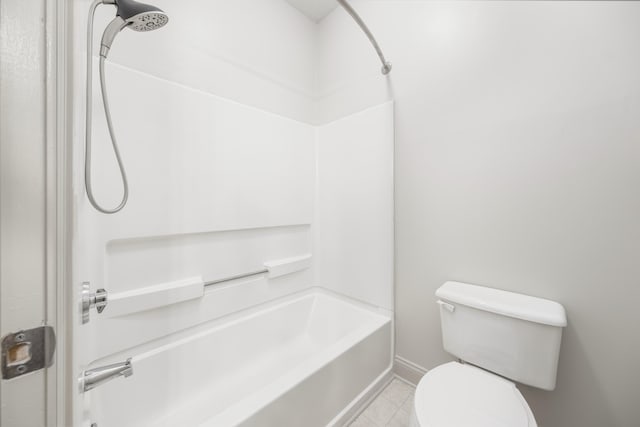 bathroom with washtub / shower combination and toilet