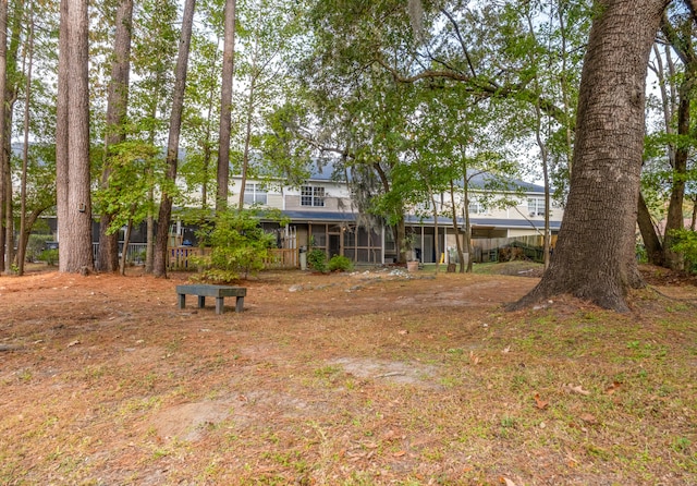 view of yard with a sunroom