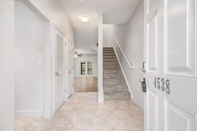 entryway featuring ceiling fan