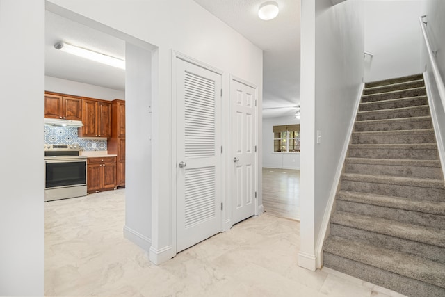 stairway with ceiling fan