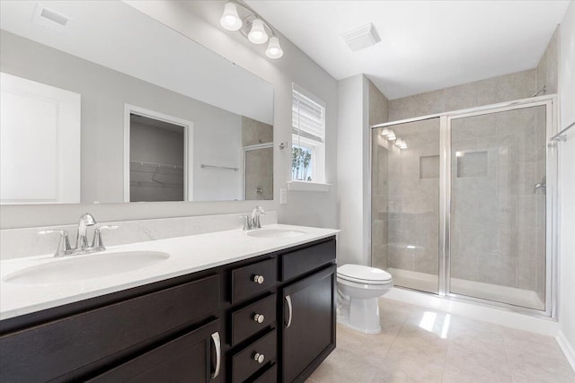 525 Purple Finch Rd, Summerville, SC 29486 - full bathroom featuring a shower stall, toilet, double vanity, tile patterned floors, and a walk in closet