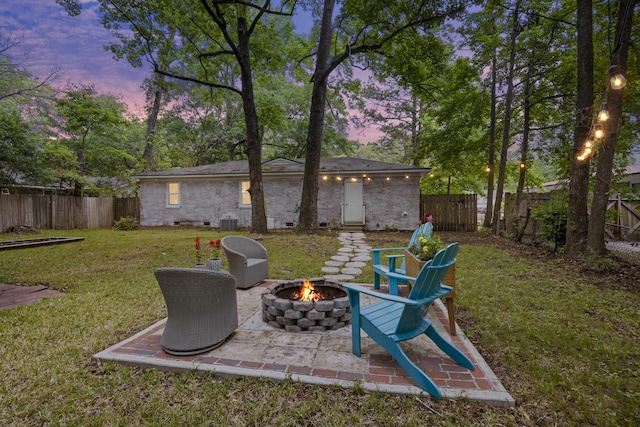 825 Savage Rd, Charleston, SC 29414 - yard at dusk featuring a fire pit and a patio