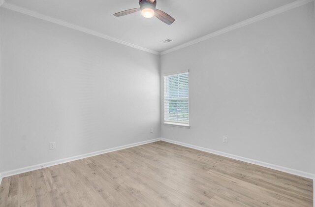 spare room with ceiling fan, baseboards, light wood-type flooring, and crown molding