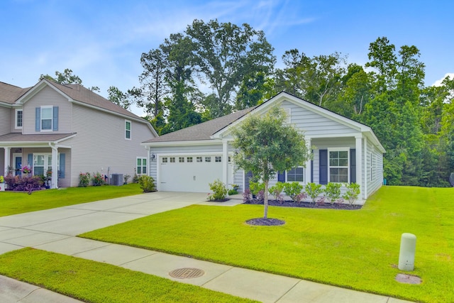 view of front of house with driveway, an attached garage, a front lawn, and central AC
