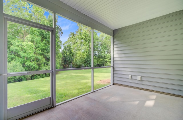 unfurnished sunroom with healthy amount of natural light