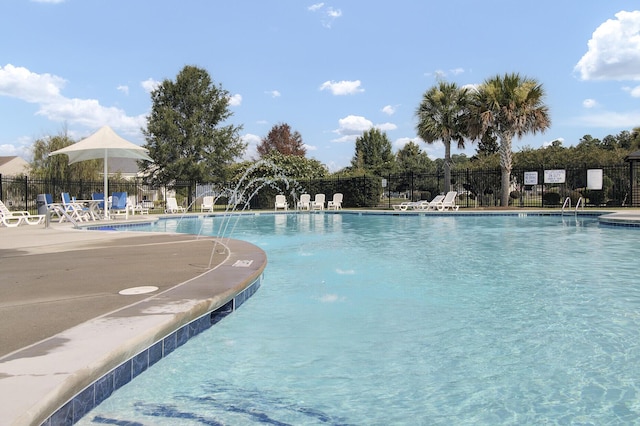 community pool featuring fence