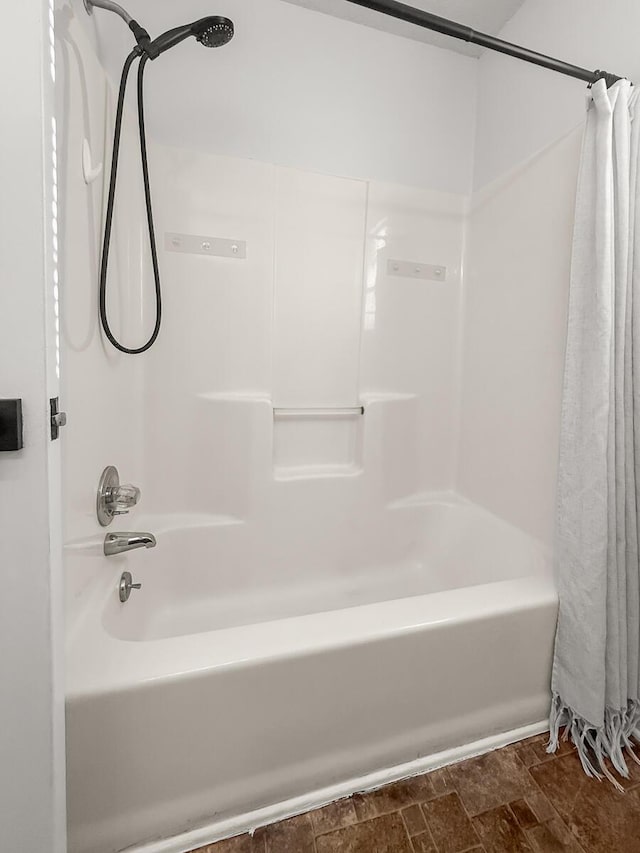 full bathroom with shower / bath combo