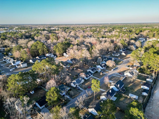 drone / aerial view with a residential view and a forest view