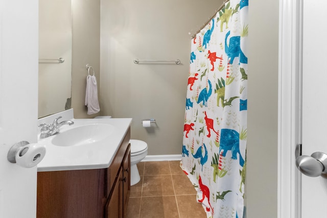 bathroom featuring tile patterned floors, vanity, toilet, and a shower with shower curtain
