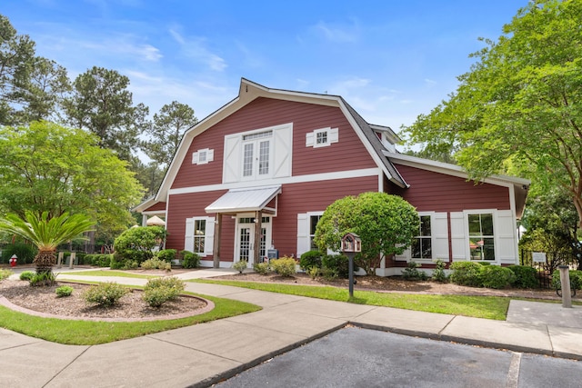 dutch colonial featuring a gambrel roof and french doors
