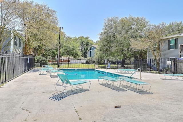 view of swimming pool featuring a patio area