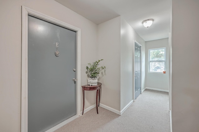 interior space featuring light colored carpet