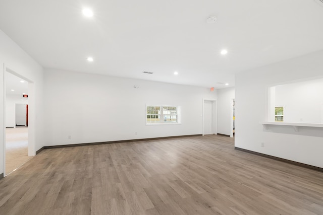 unfurnished living room with light hardwood / wood-style flooring