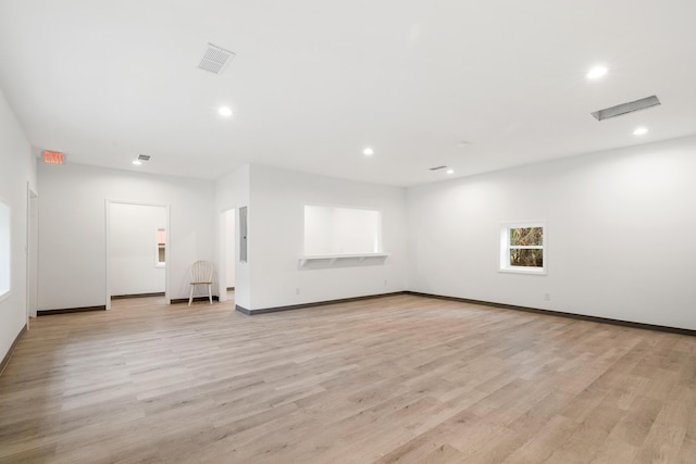 unfurnished living room featuring light hardwood / wood-style floors