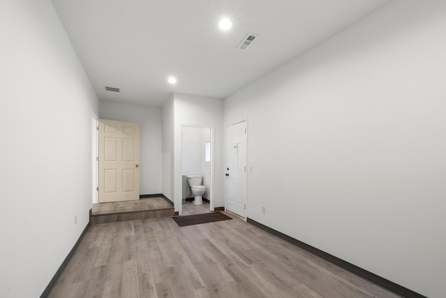 unfurnished room featuring light hardwood / wood-style floors