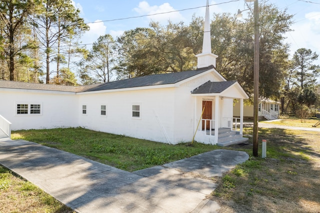 view of property exterior featuring a yard