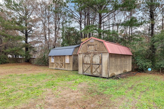 view of outbuilding with a yard