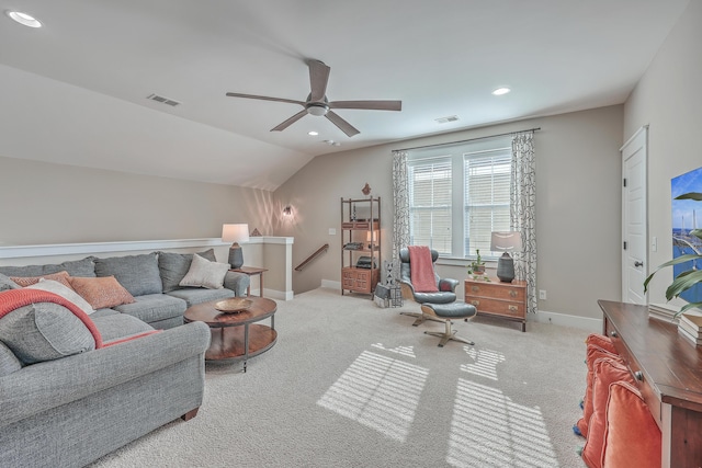 living room featuring lofted ceiling, light colored carpet, and ceiling fan