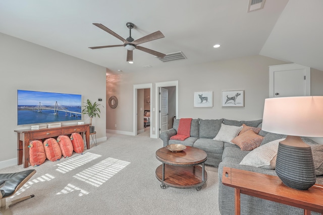 living room with light carpet, ceiling fan, and lofted ceiling