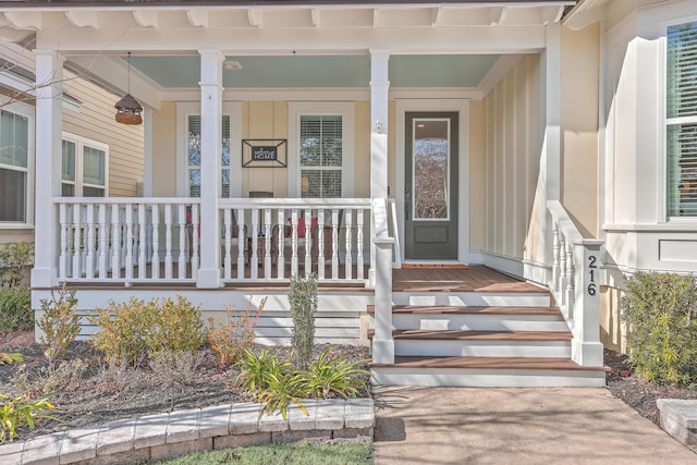 doorway to property featuring covered porch