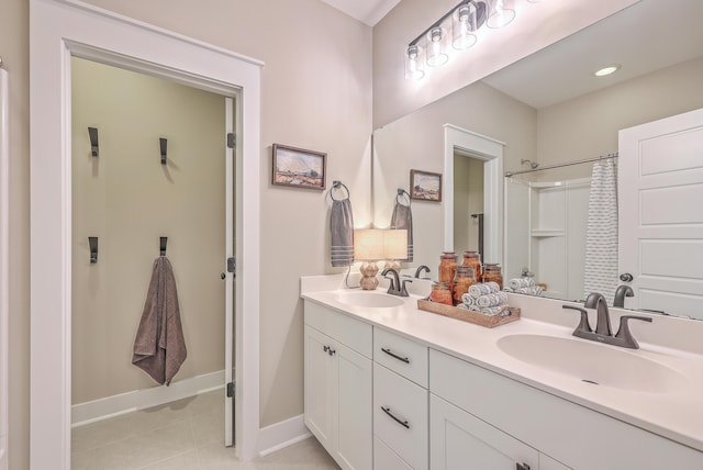 bathroom with tile patterned flooring, vanity, and a shower with curtain