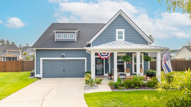 627 Macintyre Cir, Summerville, SC 29486 - view of front facade featuring covered porch, concrete driveway, a garage, a shingled roof, and a standing seam roof