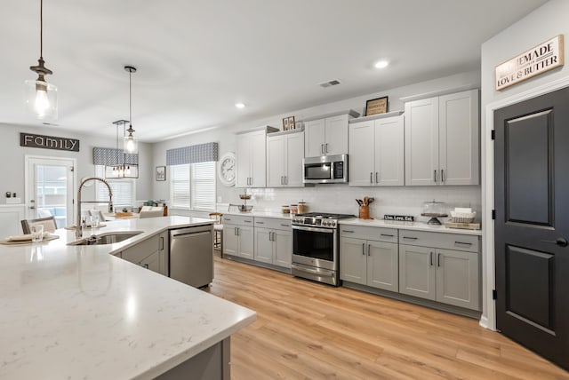 627 Macintyre Cir, Summerville, SC 29486 - kitchen featuring stainless steel appliances, a sink, gray cabinets, decorative backsplash, and recessed lighting