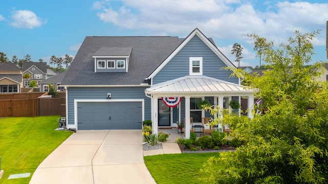 627 Macintyre Cir, Summerville, SC 29486 - view of front of house featuring covered porch, driveway, a shingled roof, and a standing seam roof